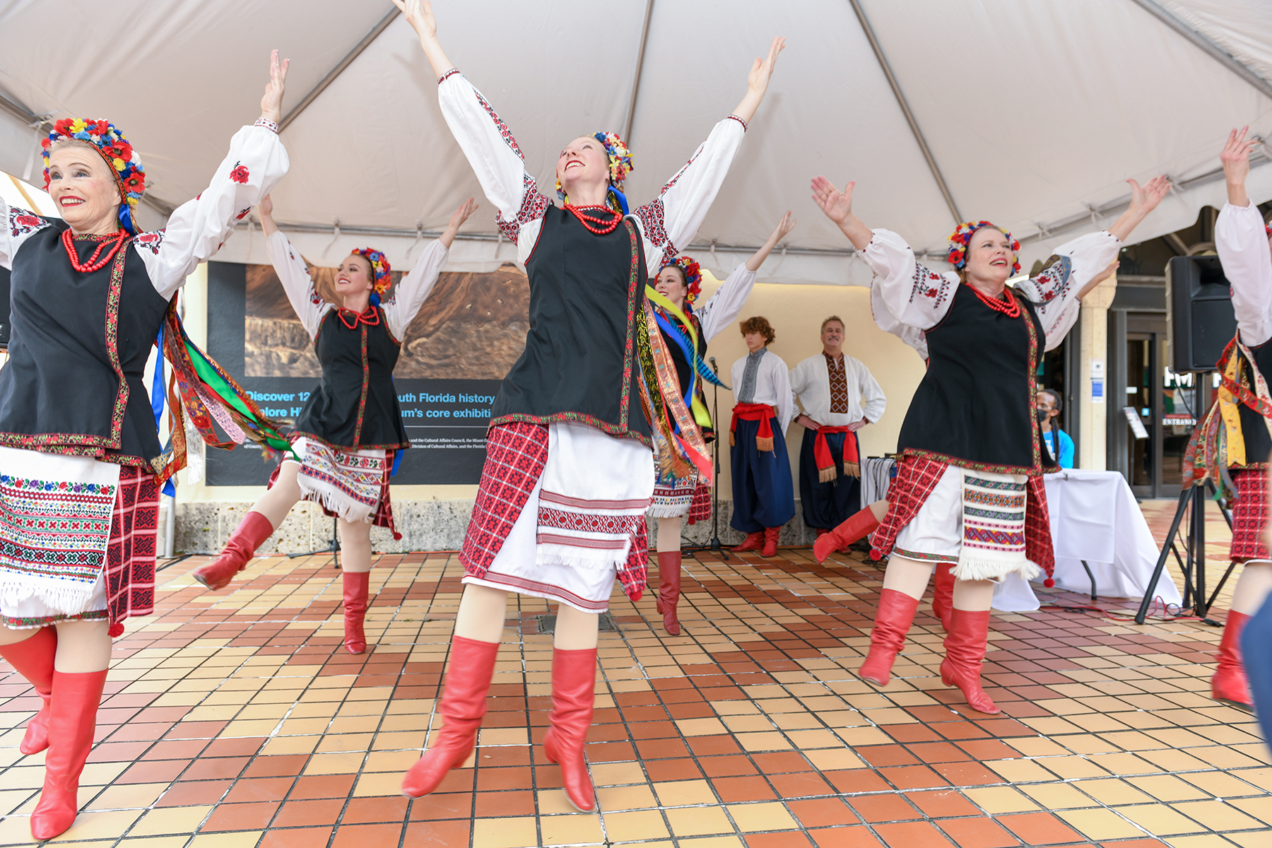 women dancing with arms high in the air
