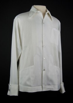 Mexican President Luis Echeverría’s Shirt. 1970s. Polyester. Calesa. In an effort to humanize the presidency, Mexican President Luis Echeverría, who served from 1970 until 1976, often wore the guayabera. His use of the shirt for government purposes both locally and internationally helped to popularize the garment in Mexico and elsewhere in Latin America. Mexican guayabera manufacturing boomed during his residency as a result. Loan courtesy of Fam. Echeverría Zuno. Mexican President Luis Echeverría’s Shirt. 1970s. Polyester. Calesa. In an effort to humanize the presidency, Mexican President Luis Echeverría, who served from 1970 until 1976, often wore the guayabera. His use of the shirt for government purposes both locally and internationally helped to popularize the garment in Mexico and elsewhere in Latin America. Mexican guayabera manufacturing boomed during his residency as a result. Loan courtesy of Fam. Echeverría Zuno.