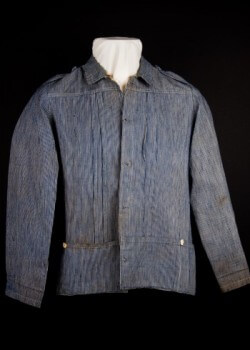 Spanish military guayabera. 1895-1898. Rayadillo. Late 19th century Spanish records indicate that Spanish soldiers in Cuba wore a field uniform called a “guayabera.” This uniform was made of a linen or cotton fabric called “rayadillo,” the material used for most of the Spanish military’s tropical uniforms of the period. Loan courtesy of the William K. Combs Collection.