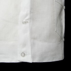 The shirt is worn untucked and features a straight hem.