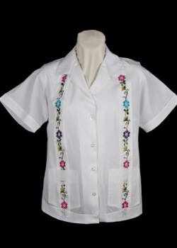 Embroidered women’s guayabera. 2012. Poly-cotton. Ravgo. Although customarily a man’s shirt, guayaberas have been made for women since at least the 1950s. Today, a wide variety of guayabera tops exist for women. Mexican manufacturer Ravgo, founded more than fifty years ago, crafted this garment that features embroidery, a recognized Mexican contribution. Collection of Museum of Miami. Gift of Ravgo. Embroidered women’s guayabera. 2012. Poly-cotton. Ravgo. Although customarily a man’s shirt, guayaberas have been made for women since at least the 1950s. Today, a wide variety of guayabera tops exist for women. Mexican manufacturer Ravgo, founded more than fifty years ago, crafted this garment that features embroidery, a recognized Mexican contribution. Collection of Museum of Miami. Gift of Ravgo.