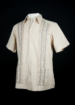Cross-stitch embroidered guayabera. 2011. Cotton-linen. La Plaza del Recreo. Hand embroidered by Doña Mary Chan May in Tekax, Yucatan, this shirt’s cross-stitch embroidery resembles that used in traditional Mayan clothing such as the huipil. Mayan textile traditions may have inspired the use of embroidery on Mexican-produced guayaberas. Collection of Museum of Miami. Cross-stitch embroidered guayabera. 2011. Cotton-linen. La Plaza del Recreo. Hand embroidered by Doña Mary Chan May in Tekax, Yucatan, this shirt’s cross-stitch embroidery resembles that used in traditional Mayan clothing such as the huipil. Mayan textile traditions may have inspired the use of embroidery on Mexican-produced guayaberas. Collection of Museum of Miami.