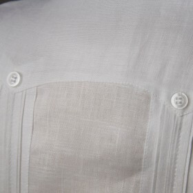 Decorative buttons ornament the shirt.