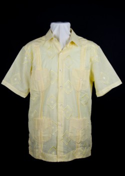 Tourist guayabera. 2012. Linen. Habanera. In Cuba today, guayaberas such as this one are sold primarily to tourists. After the 1959 revolution, the use of the shirt by locals gradually decreased. Most contemporary Cubans associate the garment with a bygone era, with the government, including the state police, and with the tourist industry. Collection of Museum of Miami.