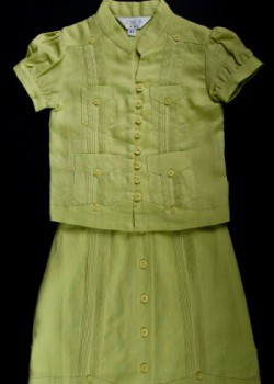 Girl’s guayabera ensemble. 2012. Linen. JMP. Based in Miami, JMP entered the guayabera business during the early 2000s. The company has focused on producing pieces for the whole family, including a variety of items for toddler girls such as this matching top and skirt. Collection of Museum of Miami. Girl’s guayabera ensemble. 2012. Linen. JMP. Based in Miami, JMP entered the guayabera business during the early 2000s. The company has focused on producing pieces for the whole family, including a variety of items for toddler girls such as this matching top and skirt. Collection of Museum of Miami.