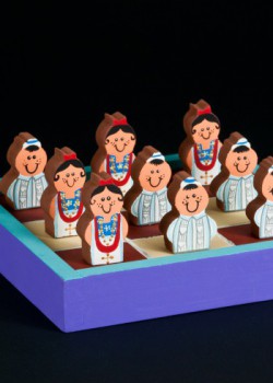 Tourist items featuring the guayabera. Circa 2012. Tourist shops in Merida sell a variety of merchandise featuring the guayabera. These souvenirs include banks, ashtrays, tic-tac-toe games, nativity scenes, toys and other items. Collection of Museum of Miami. Tourist items featuring the guayabera. Circa 2012. Tourist shops in Merida sell a variety of merchandise featuring the guayabera. These souvenirs include banks, ashtrays, tic-tac-toe games, nativity scenes, toys and other items. Collection of Museum of Miami.