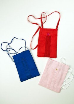 Guayabera pocket purses. 2011. Linen. Berta Gonzalez. Handmade by Berta Gonzalez, an elder of the guayabera tradition in Miami, these purses are designed to be used as travel pouches, useful for carrying a passport, phone and other items. Collection of Museum of Miami. Gift of The Guayabera Lady. Guayabera pocket purses. 2011. Linen. Berta Gonzalez. Handmade by Berta Gonzalez, an elder of the guayabera tradition in Miami, these purses are designed to be used as travel pouches, useful for carrying a passport, phone and other items. Collection of Museum of Miami. Gift of The Guayabera Lady.