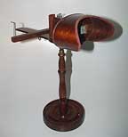 Developing in tandem with photography, stereography began in Great Britain in the 1830s with Sir Charles Wheatstone’s experimental stereoscope. This instrument allowed a viewer to look through two lenses that focused on a card containing two nearly identical images, giving the viewer the illusion of a single image in three-dimensions.